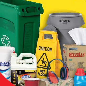 An assortment of janitorial supplies including a waste bin, wet floor caution sign, wipes, paper towels, and chemical cleaners